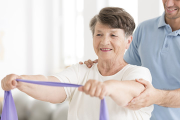 Happy senior woman stretching