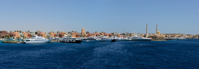 SHARM EL SHEIKH, EGYPT - JUNE 8, 2017: east dock blue sea and big luxury yachts panorama. Editorial photo
