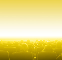 Obraz premium viewers at movie theater, yellow toning copy space