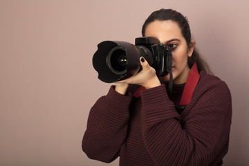 Photographer taking photos with a DSLR camera