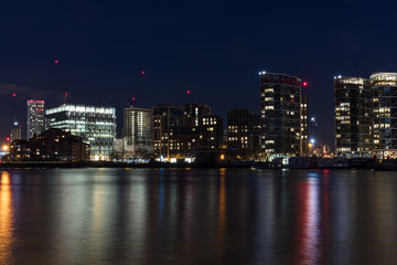 Fototapeta na wymiar London, UK - Feb 7th, 2018: Inaugurated in Jan 2018, the new 518,000 sq foot, 12-story home of the United States Embassy in London at Nine Elms. Long-exposure at night overlooking River Thames