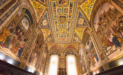 Amazing interior of Siena cathedral of Saint Mary Assumption, Piccolomini Library in Tuscany, Italy