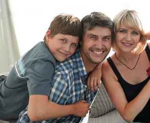 Happy family on their sofa at home