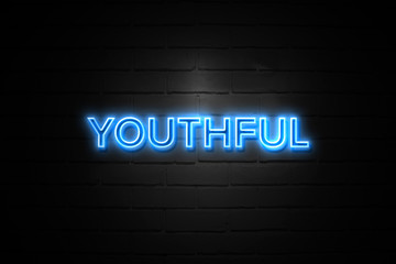 Youthful neon Sign on brickwall
