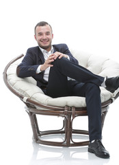young businessman sitting in a comfortable chair