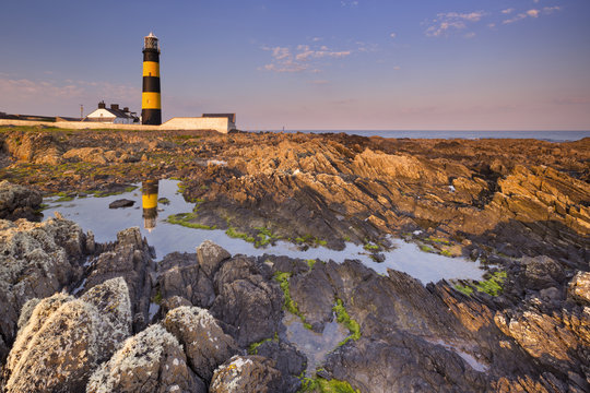 Lighthouse in Northern Ireland at sunset