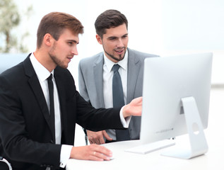 Fototapeta premium employees are talking sitting behind a Desk