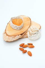 Cake in a casket in the form of heart on a section of wood