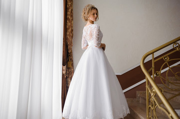 Fototapeta premium Beautiful bride in wedding dress