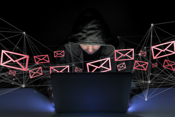 Hacker man in the dark using computer to hack data and information system