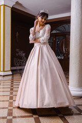 Fototapeta premium Beautiful bride in wedding dress interior