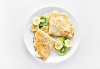 Sweet crepes with banana and kiwi slices © voltan