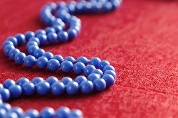Blue beads on a red background
