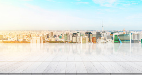 Business concept - Empty marble floor top with panoramic modern cityscape building bird eye aerial view under sunrise and morning bright sky of Tokyo, Japan, for display or montage product.