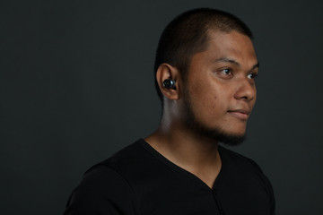 man using gadget with different expression in gray background