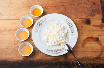 Dietary low calorie cottage cheese with honey, tasty and healthy snack,