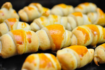 Freshly baked sweet rolls. Baking domestic rolls with cheese