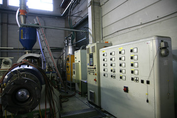 factory shop production of polyethylene film mechanisms machine tools lifting mechanism wires hoses switches pressure gauges pressure temperature molten mass work place enterprise