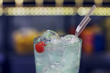 The glass of water and soda with ice and straws, closeup
