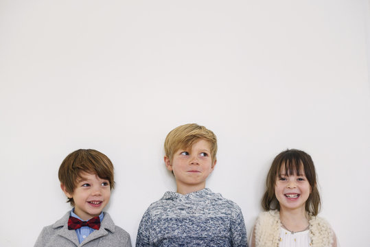 Portrait of three smiling children