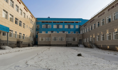 Fototapeta na wymiar School building. Modern architecture. Secondary school in the city of Ust-Kamenogorsk, Kazakhstan