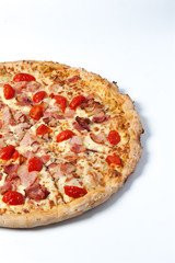 Tasty italian pizza with ham, cherry tomatoes and cheese isolated at white background. Place for text