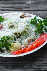 on the background of wooden boards , iceberg lettuce, quail eggs,