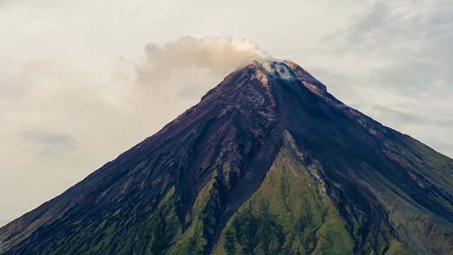 Mayon Volcano in Legazpi, Philippines. Mayon Volcano is an active volcano and rising 2462 meters from the shores of the Gulf of Albay.