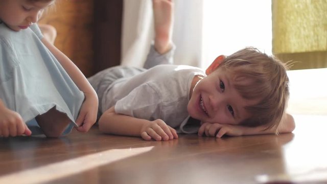 cute boy lying on the floor looking at camera, portrait