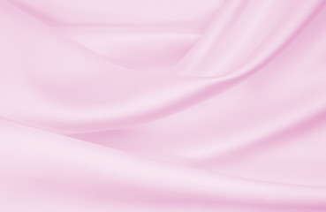 Smooth elegant pink silk or satin texture as wedding background. Luxurious valentine day background design