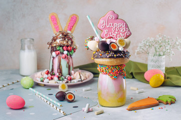 Easter freak shake decorated with Easter bunny gingerbread on table
