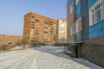 Multi-storey residential buildings and secondary school. Modern architecture. Kazakhstan, Ust-Kamenogorsk