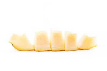 Sliced honeydew melon tropical fruit isolated on a white background.