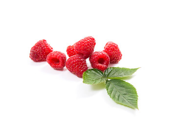 Ripe raspberries with leaf isolated on white background.