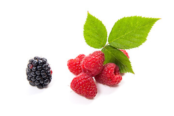 Ripe raspberries with leaf and blackberry isolated on white background.