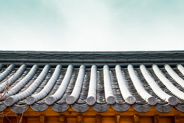 Korean traditional roof tile eaves background © Sanga