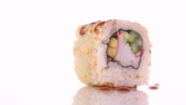 Sushi roll japanese food rotated over white background. 4K UHD video footage. 3840X2160