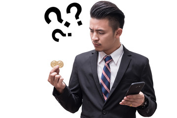 the isolated image of businessmen are skeptical about bitcoin in his hand. The concept of cryptocurrency, trading, economy, Bitcoin mining, financial and technology.