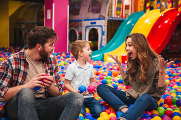 Fototapeta premium Young happy family with their little son