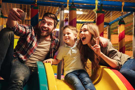 Cheerful family with their little son