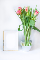 Spring composition with fresh tulips and frame. Copy space 