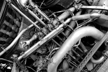 F-1 Rocket booster engine close up with a complex array of pipes and fuel lines.
