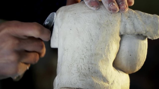 gypsum art sculpture making - Sculptor works musician statue from gypsum
