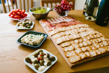 Crackers with ham different appetizer. Snacks on the tray. Soft focus