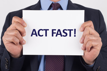Man showing paper with ACT FAST! text