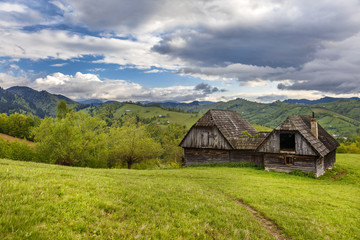 Fototapeta na wymiar Mountain farm with old wooden house near Bran, Transylvania,