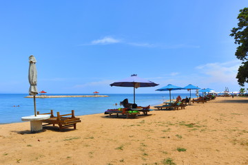 Fototapeta na wymiar Beach Parasols and Chairs At Sanur Beach, Bali, Indonesia