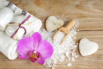 Ingredients for spa procedures are white on a wooden table, top view.