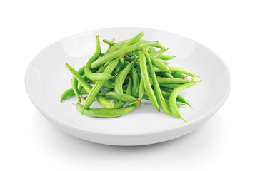 green beans in plate on white background