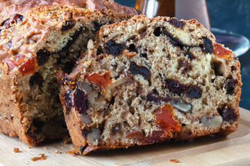 Traditional stollen fruit cake sliced on table